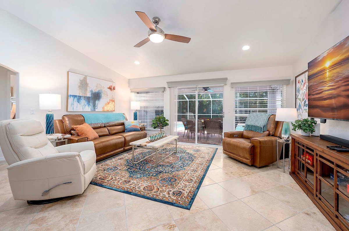 Überdachte Lanai mit Grill und Essbereich im Außenbereich